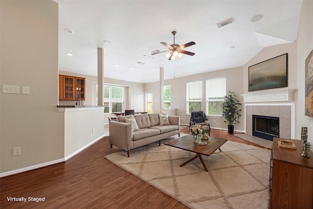 7431 Pony Crk, Missouri City, TX 77459 - living area featuring wood finished floors, baseboards, ceiling fan, a tile fireplace, and recessed lighting