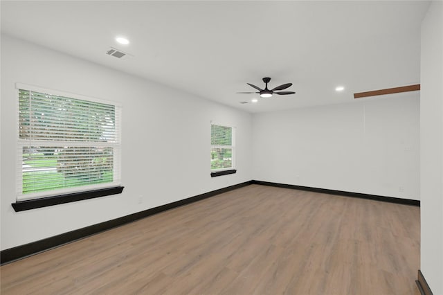 unfurnished room featuring wood finished floors, recessed lighting, ceiling fan, and baseboards