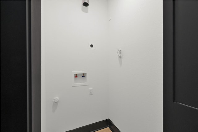 clothes washing area with hookup for a washing machine and hookup for an electric dryer
