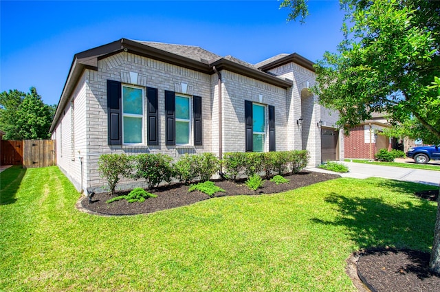 view of front of house featuring concrete driveway, brick siding, fence, and a garage