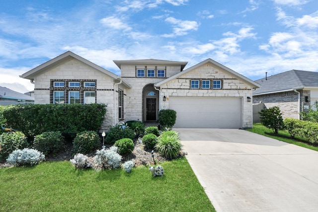 view of front of home featuring stone siding, concrete driveway, an attached garage, and a front lawn