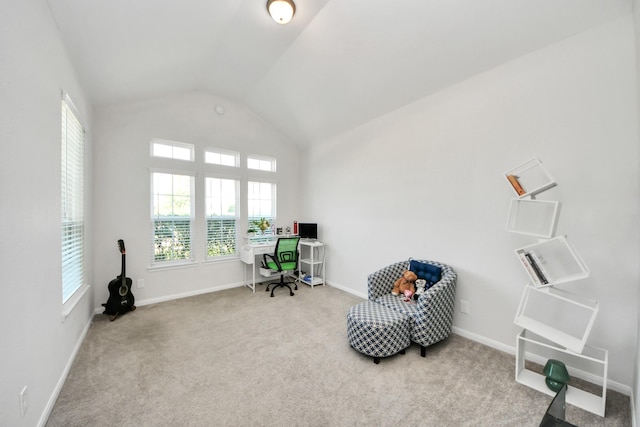 carpeted office space featuring baseboards and high vaulted ceiling