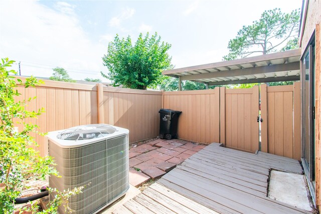 2429 Briarwest Blvd, Houston, TX 77077 - wooden deck with central AC and fence