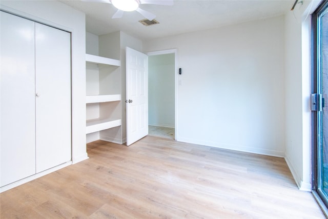 2429 Briarwest Blvd, Houston, TX 77077 - unfurnished bedroom featuring light wood-type flooring, a closet, a ceiling fan, and baseboards