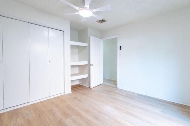 2429 Briarwest Blvd, Houston, TX 77077 - unfurnished bedroom featuring light wood-style flooring, a closet, ceiling fan, and baseboards