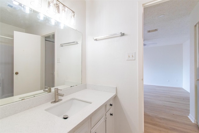 2429 Briarwest Blvd, Houston, TX 77077 - bathroom featuring wood finished floors, vanity, and baseboards