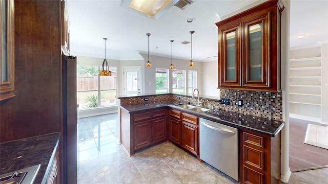 kitchen featuring stainless steel appliances, visible vents, ornamental molding, and a sink