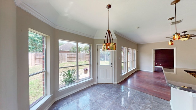 interior space featuring visible vents, crown molding, and plenty of natural light