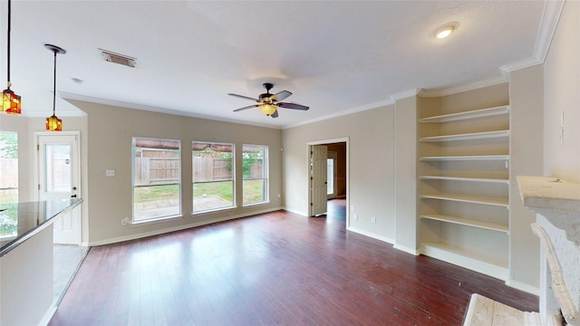 unfurnished living room featuring plenty of natural light, visible vents, baseboards, and hardwood / wood-style floors