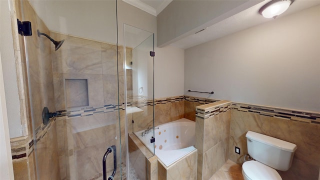 full bathroom with toilet, tile walls, ornamental molding, a jetted tub, and a shower stall