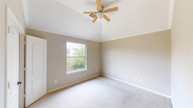 empty room with light colored carpet, baseboards, and a ceiling fan