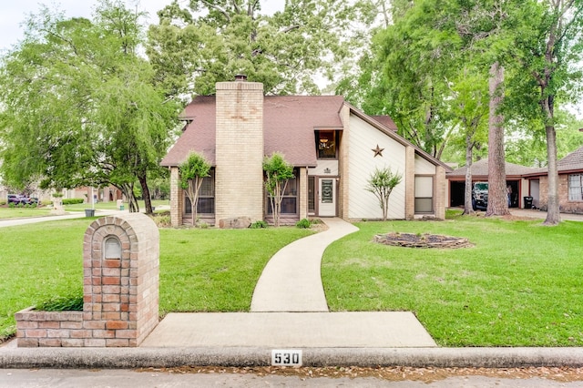 view of front of house featuring a front lawn and a chimney