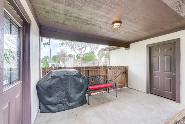 view of patio / terrace with area for grilling and fence