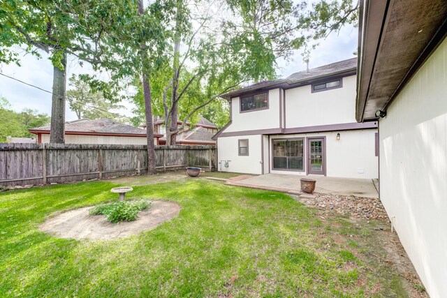 view of yard with a patio and a fenced backyard