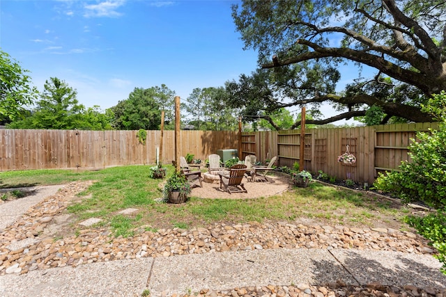 fenced backyard featuring a fire pit and a patio area