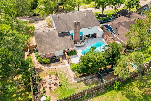aerial view of property and surrounding area with a pool area