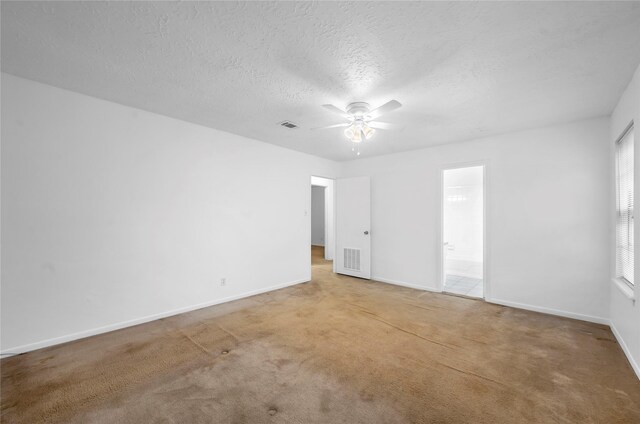 2422 Deasa Dr, Spring, TX 77373 - spare room with a ceiling fan, baseboards, visible vents, and light colored carpet