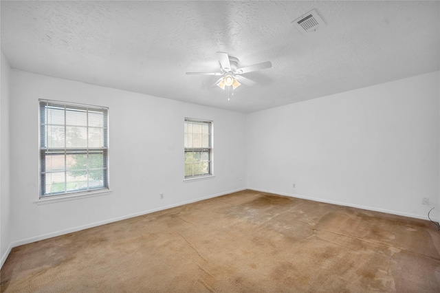 2422 Deasa Dr, Spring, TX 77373 - unfurnished room with ceiling fan, carpet, visible vents, and a healthy amount of sunlight