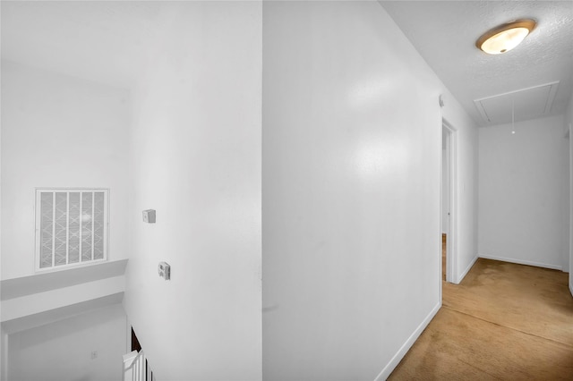 2422 Deasa Dr, Spring, TX 77373 - hallway featuring attic access, a textured ceiling, carpet, baseboards, and visible vents