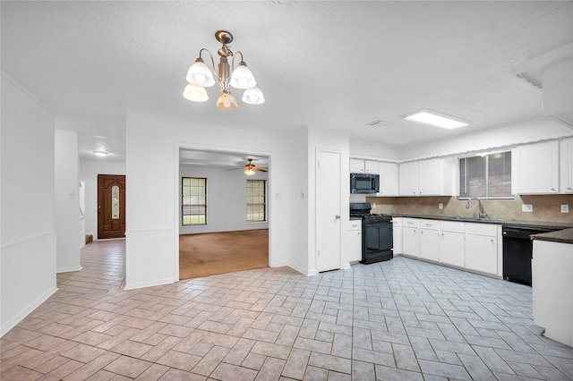 2422 Deasa Dr, Spring, TX 77373 - kitchen featuring a sink, white cabinetry, backsplash, black appliances, and dark countertops