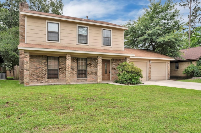 2422 Deasa Dr, Spring, TX 77373 - traditional-style home with an attached garage, brick siding, driveway, a front lawn, and a chimney