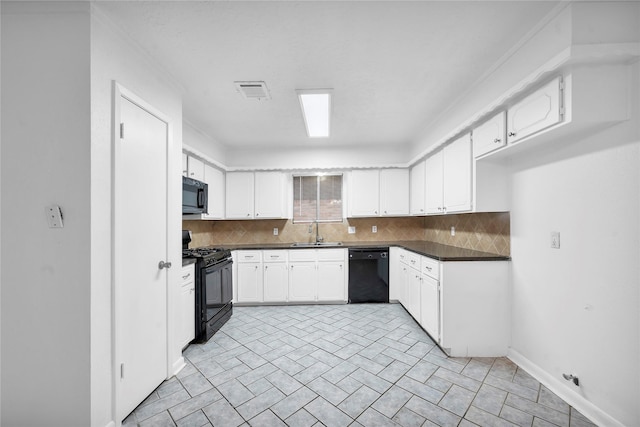 2422 Deasa Dr, Spring, TX 77373 - kitchen featuring black appliances, dark countertops, decorative backsplash, and a sink