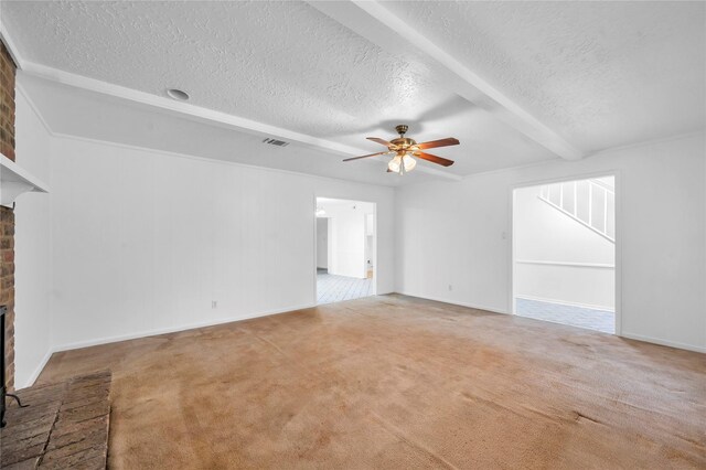 2422 Deasa Dr, Spring, TX 77373 - unfurnished living room with ceiling fan, a textured ceiling, visible vents, and a brick fireplace