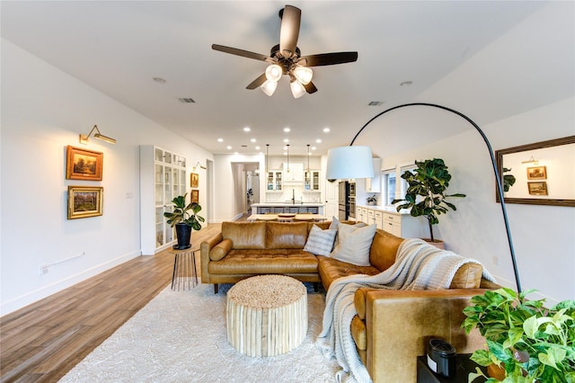 20447 Avelignese Way, Tomball, TX 77377 - living area with wood finished floors, a ceiling fan, visible vents, baseboards, and recessed lighting