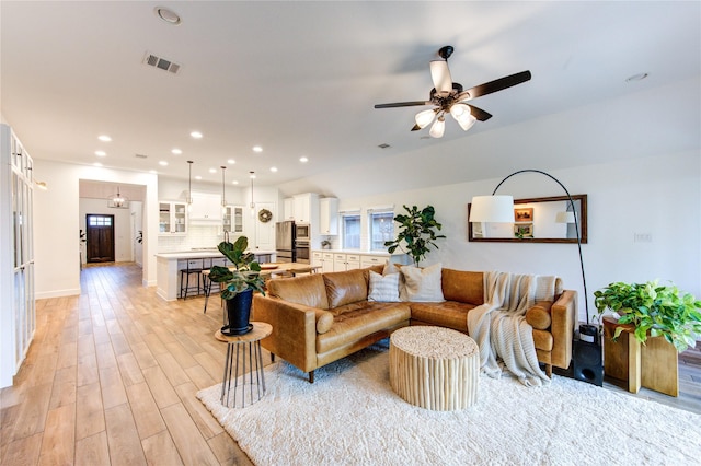 20447 Avelignese Way, Tomball, TX 77377 - living room with a ceiling fan, recessed lighting, baseboards, visible vents, and light wood-type flooring