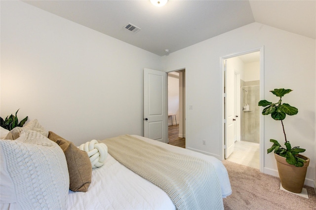20447 Avelignese Way, Tomball, TX 77377 - carpeted bedroom featuring baseboards, ensuite bath, visible vents, and vaulted ceiling