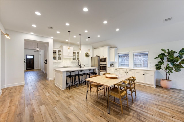 20447 Avelignese Way, Tomball, TX 77377 - dining space with light wood-type flooring, visible vents, baseboards, and recessed lighting