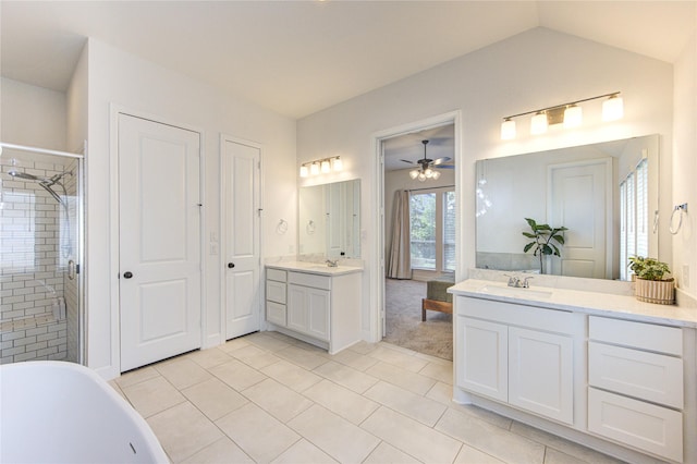 20447 Avelignese Way, Tomball, TX 77377 - bathroom featuring a stall shower, tile patterned flooring, ceiling fan, and a sink