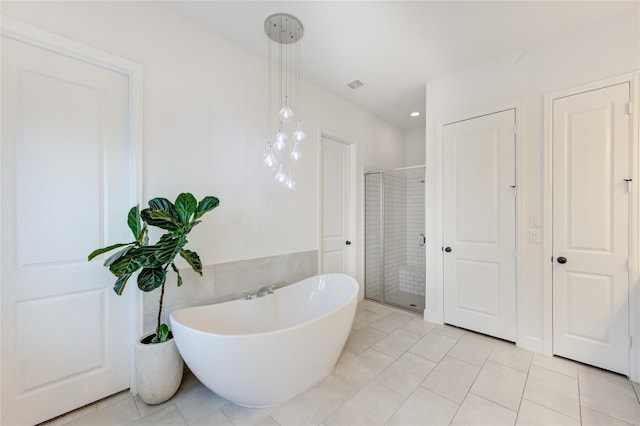 20447 Avelignese Way, Tomball, TX 77377 - bathroom featuring tile patterned floors, a freestanding bath, and a shower stall