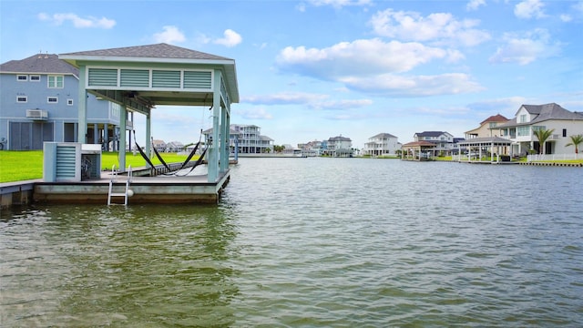 view of dock with a water view and a residential view