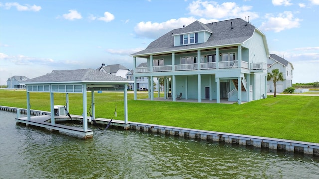 rear view of house with a patio, a water view, a shingled roof, central AC unit, and a yard