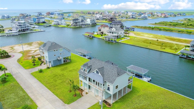 birds eye view of property featuring a water view and a residential view