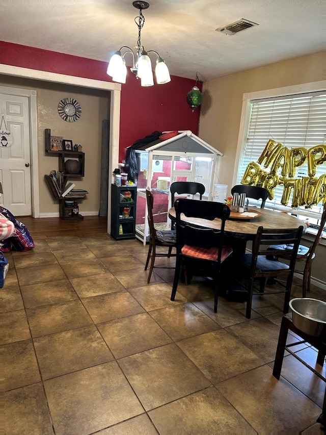 dining area with tile patterned flooring and visible vents