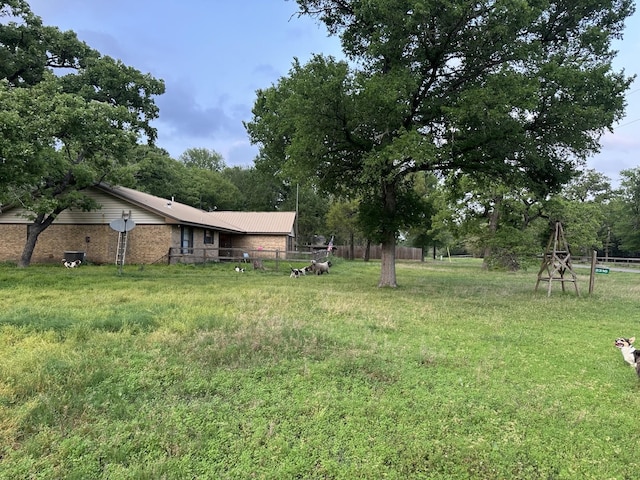view of yard featuring fence