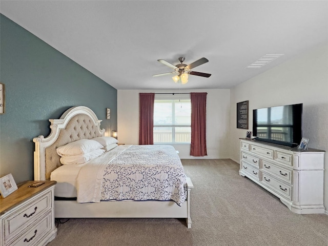 bedroom featuring ceiling fan, light carpet, and visible vents