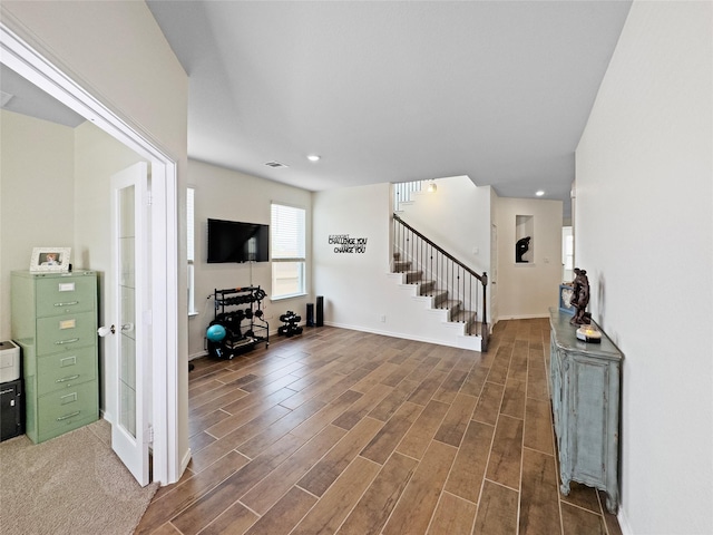 entryway featuring wood finished floors, visible vents, recessed lighting, stairway, and baseboards