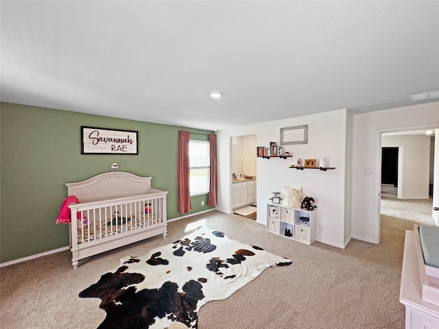 carpeted bedroom with baseboards