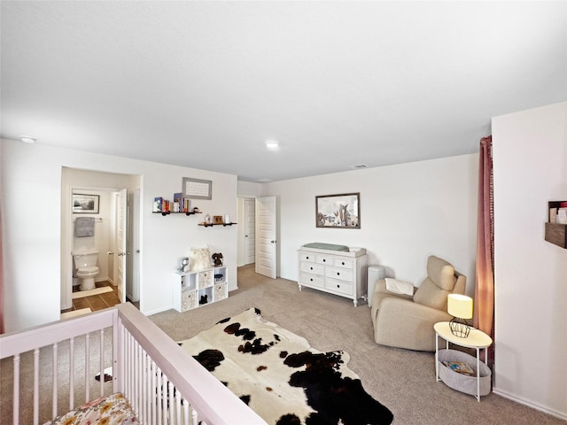 bedroom with carpet and baseboards