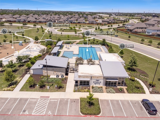 birds eye view of property with a residential view