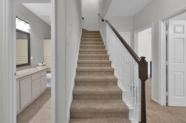 staircase with carpet flooring