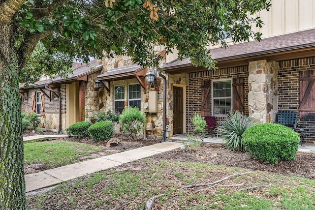 3338 Cullen Trl, College Station, TX 77845 - ranch-style home with stone siding, brick siding, and board and batten siding