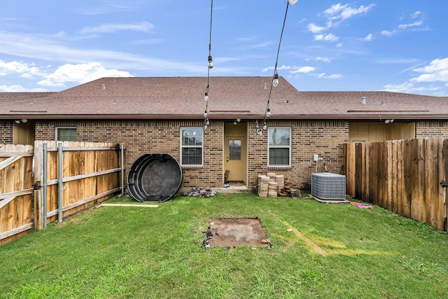 3338 Cullen Trl, College Station, TX 77845 - rear view of property featuring cooling unit, brick siding, and a fenced backyard