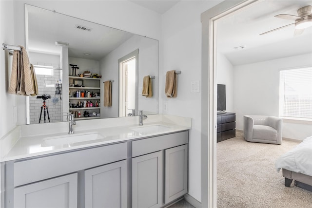 13938 Red River Dr, Baytown, TX 77523 - ensuite bathroom featuring ensuite bathroom, visible vents, ceiling fan, and a sink