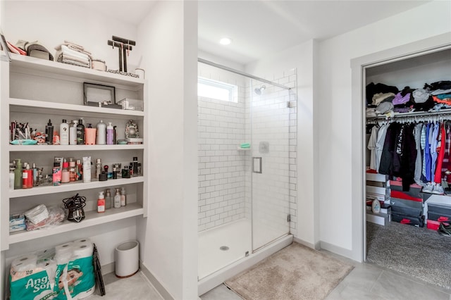 13938 Red River Dr, Baytown, TX 77523 - full bath featuring a shower stall, tile patterned floors, and a walk in closet
