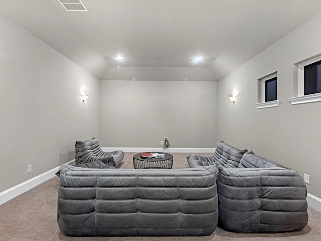 home theater room with carpet floors, baseboards, and visible vents