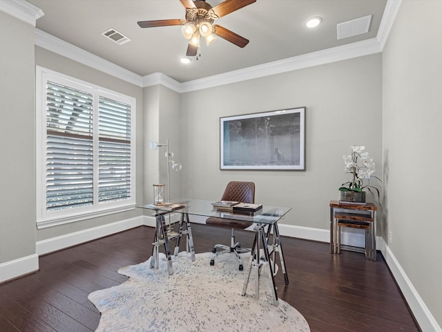 home office with hardwood / wood-style floors, visible vents, baseboards, ceiling fan, and ornamental molding